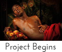 "Project Begins" button - image of nude black man in red cloth with basket of fruit